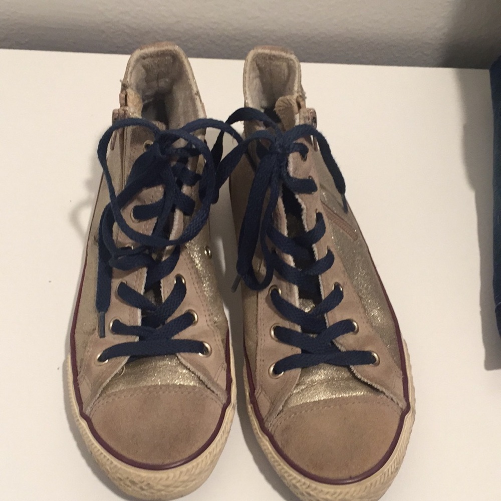 Gold sparkly high top converse